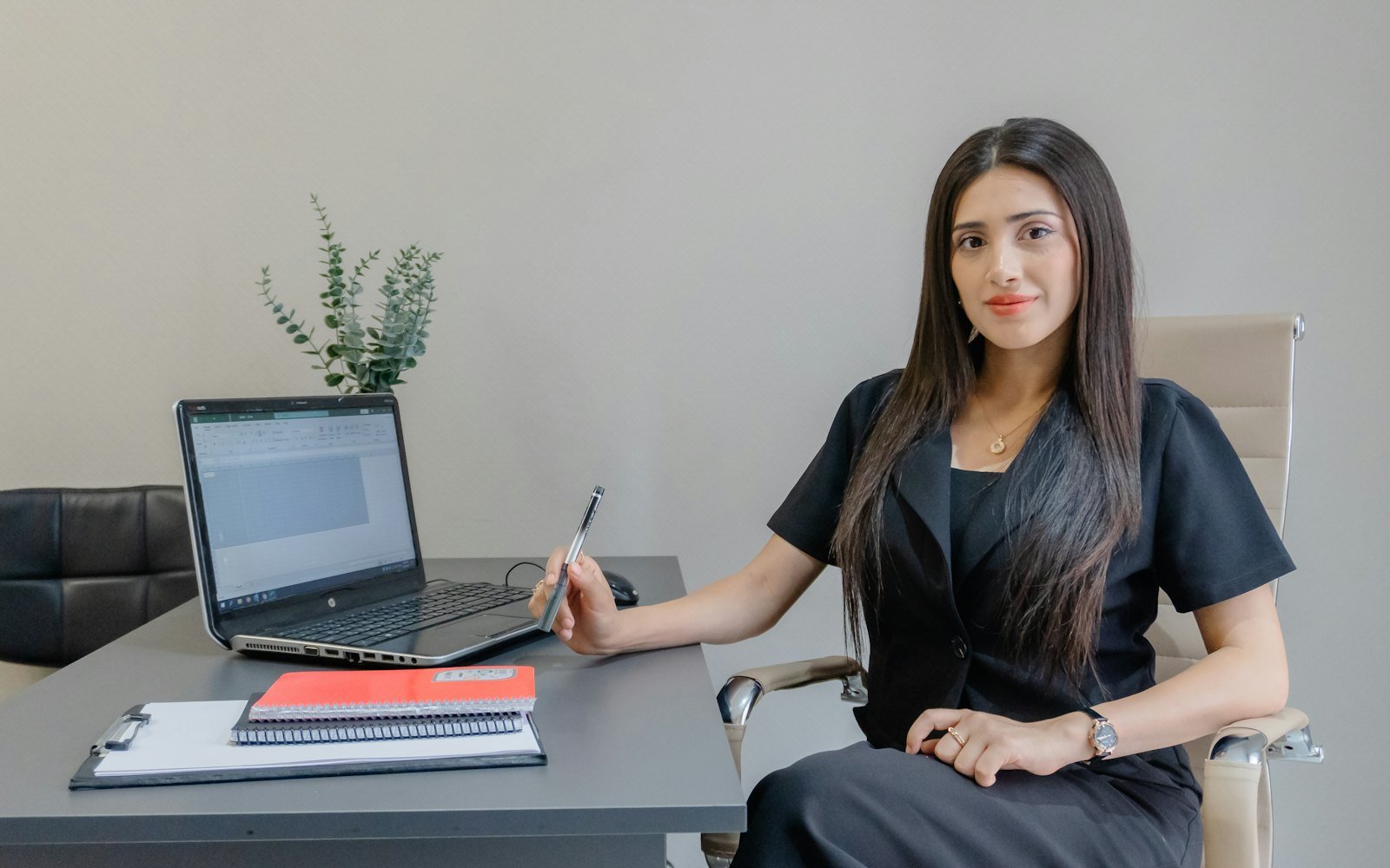 An Indian professional working on an email campaign at her desk